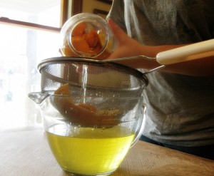 Pour cleaner into a strainer. 